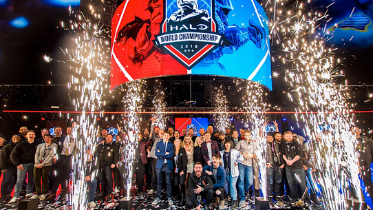 Event Staff and 343 employees at the 2018 Halo World Championship on stage with fire works exploding around them