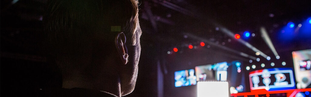 Back of a player player looking at the main stage