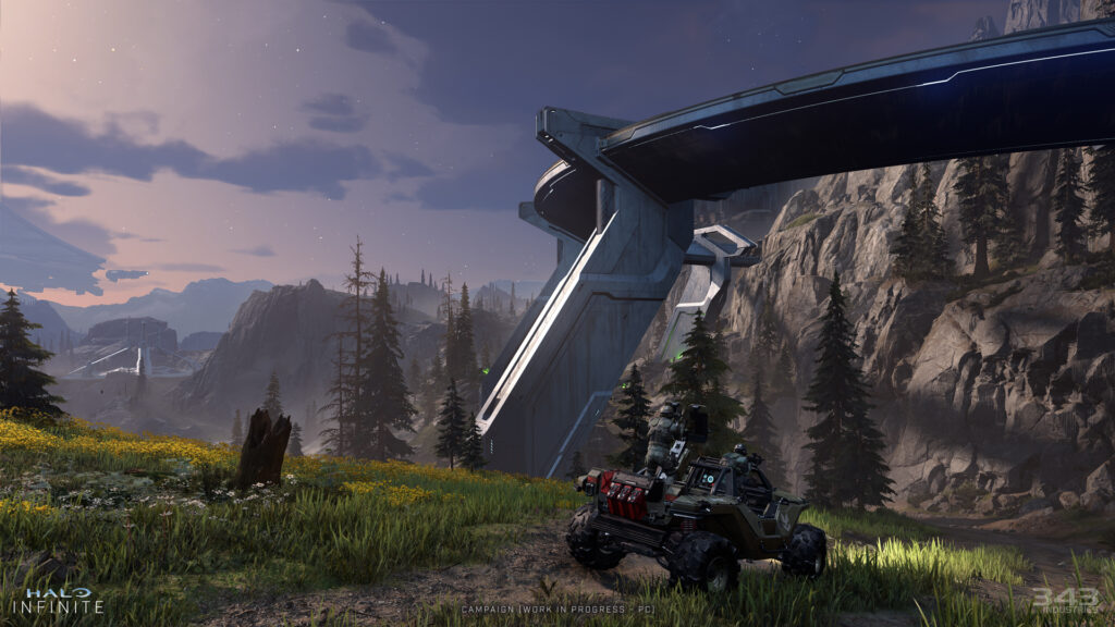 Zeta Halo at dusk with a Warthog in the foreground and mysterious forerunner buildings in the distance.