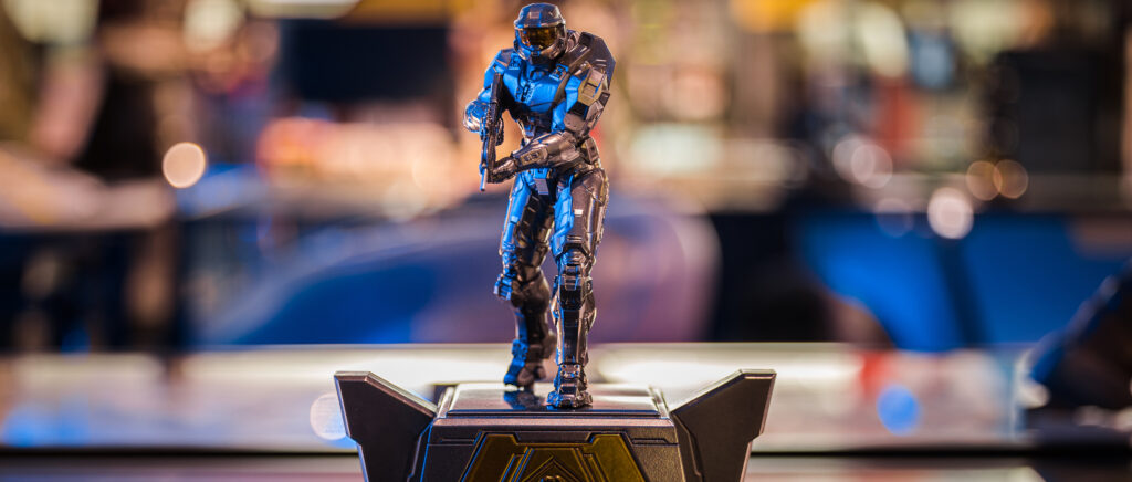 The HCS 2022 Season MVP Trophy - silver Master Chief wit ha battle rifle standing atop a silver and gold base. 