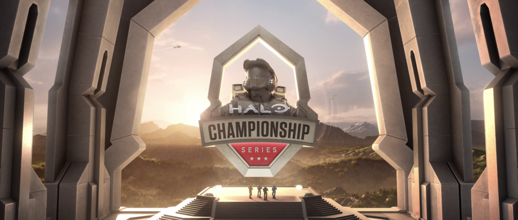 A monument of the HCS logo with a beautiful sunset and mountain range in the background