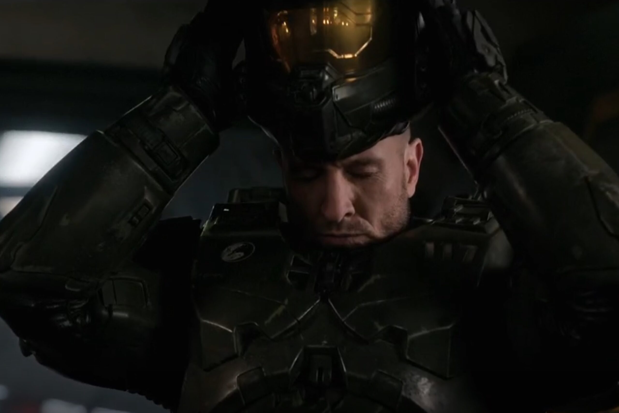 Halo TV still of the Master Chief putting his helmet on.