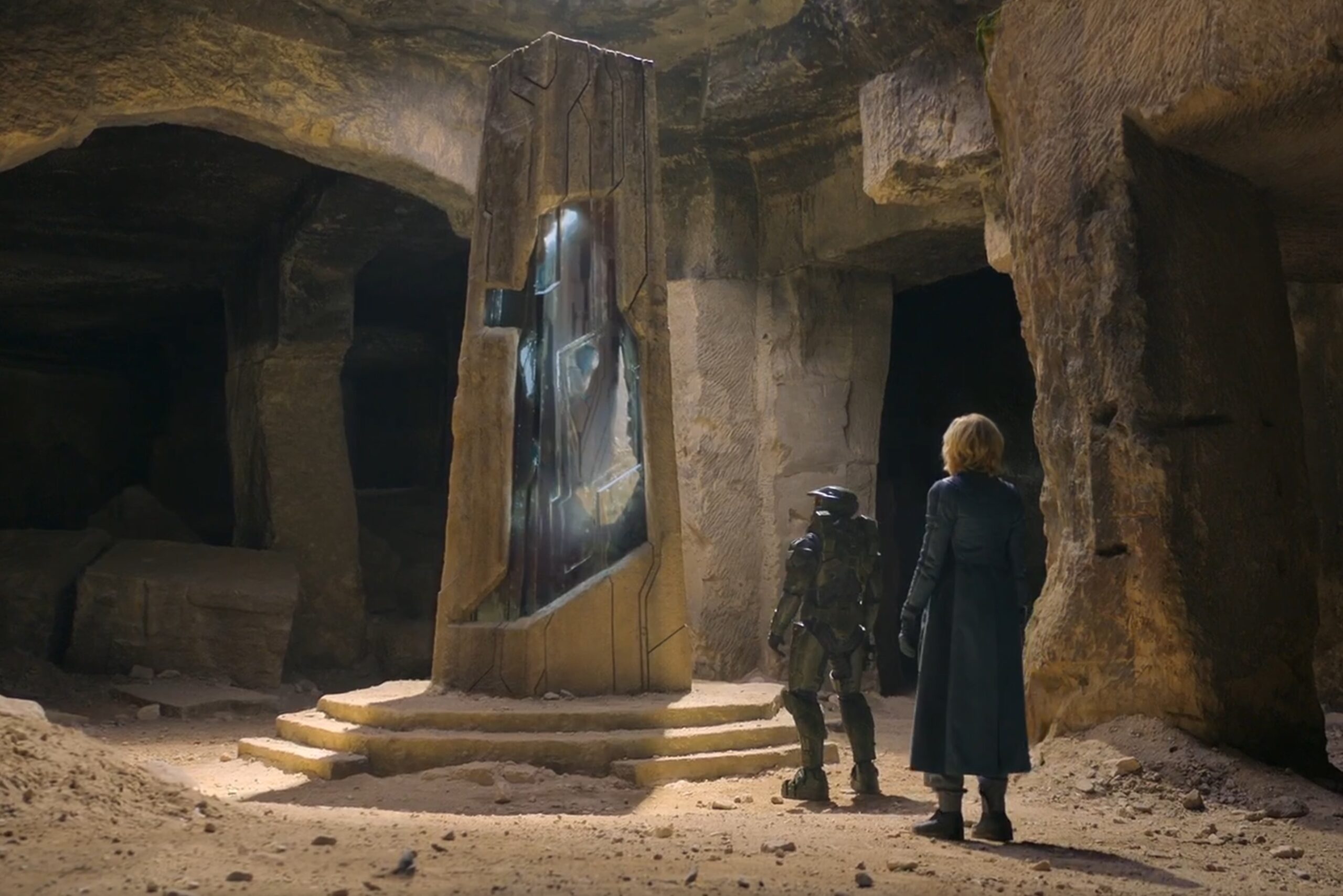 Halo TV series still of Master Chief and Dr. Halsey observing alien artifact on Eridanus II