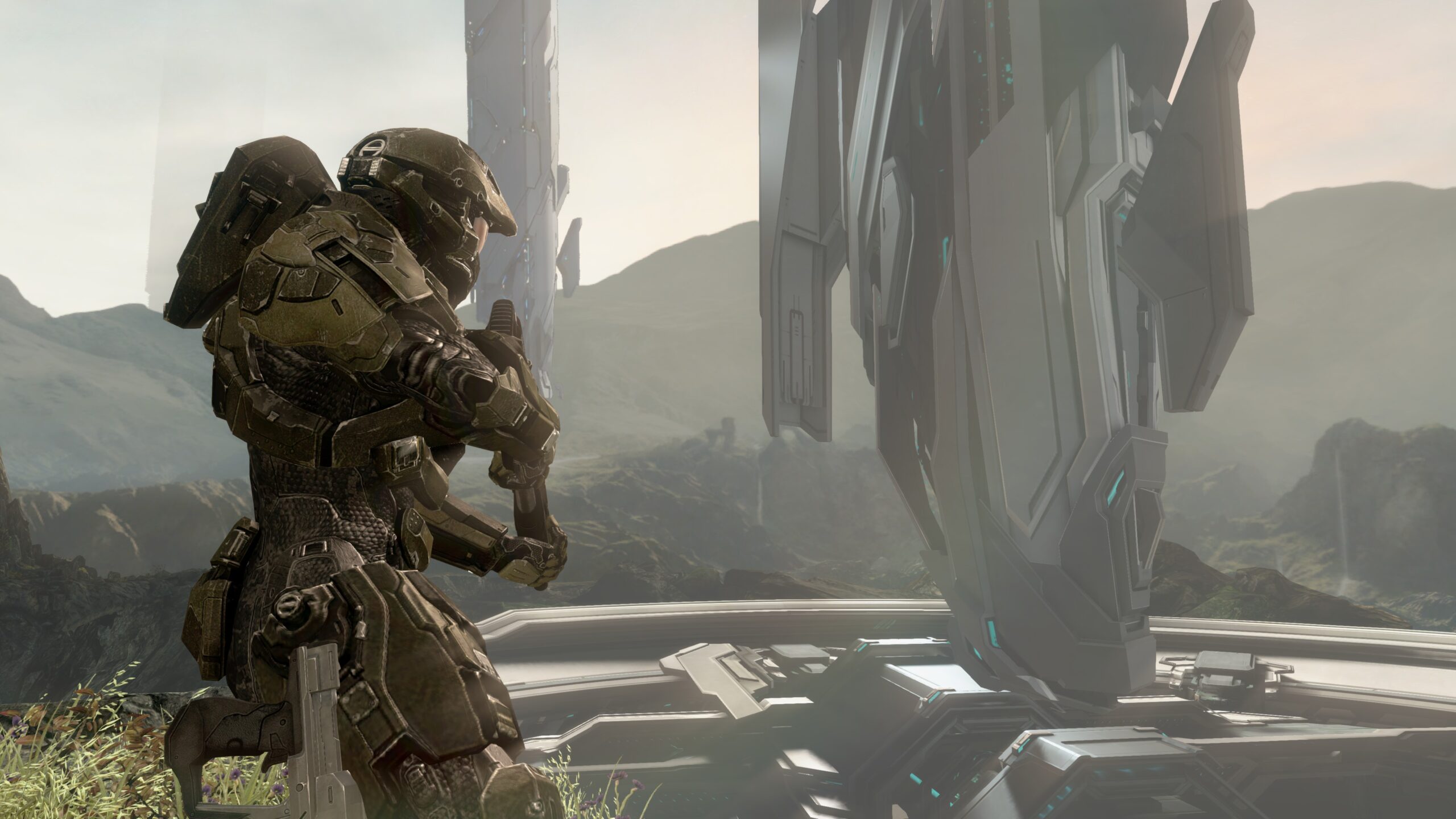 Halo 4 in-game screenshot of the Master Chief gazing out at the floating spires of Requiem