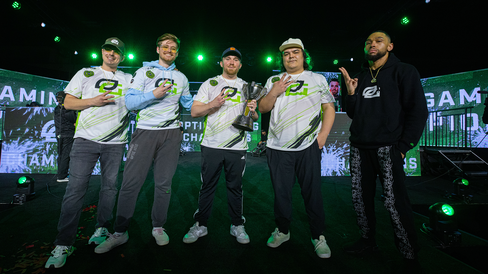 HCS Charlotte 2023 Champions, OpTic Gaming, posing with Trophy on Mainstage