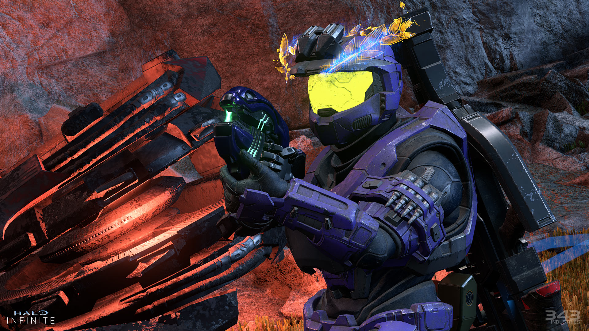 A Spartan wearing purple Mark V [B] armor holds a Plasma Pistol with a destroyed Brute Chopper in flames behind them.