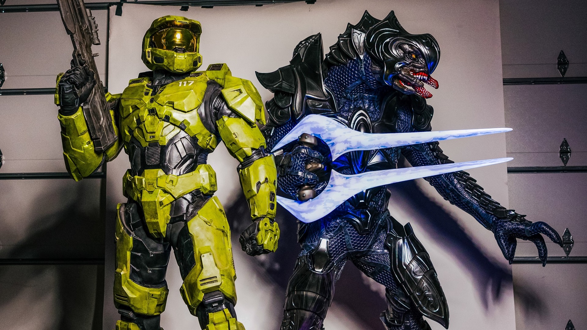 Photograph of life-sized statues of the Master Chief and the Arbiter created by Galactic Armory