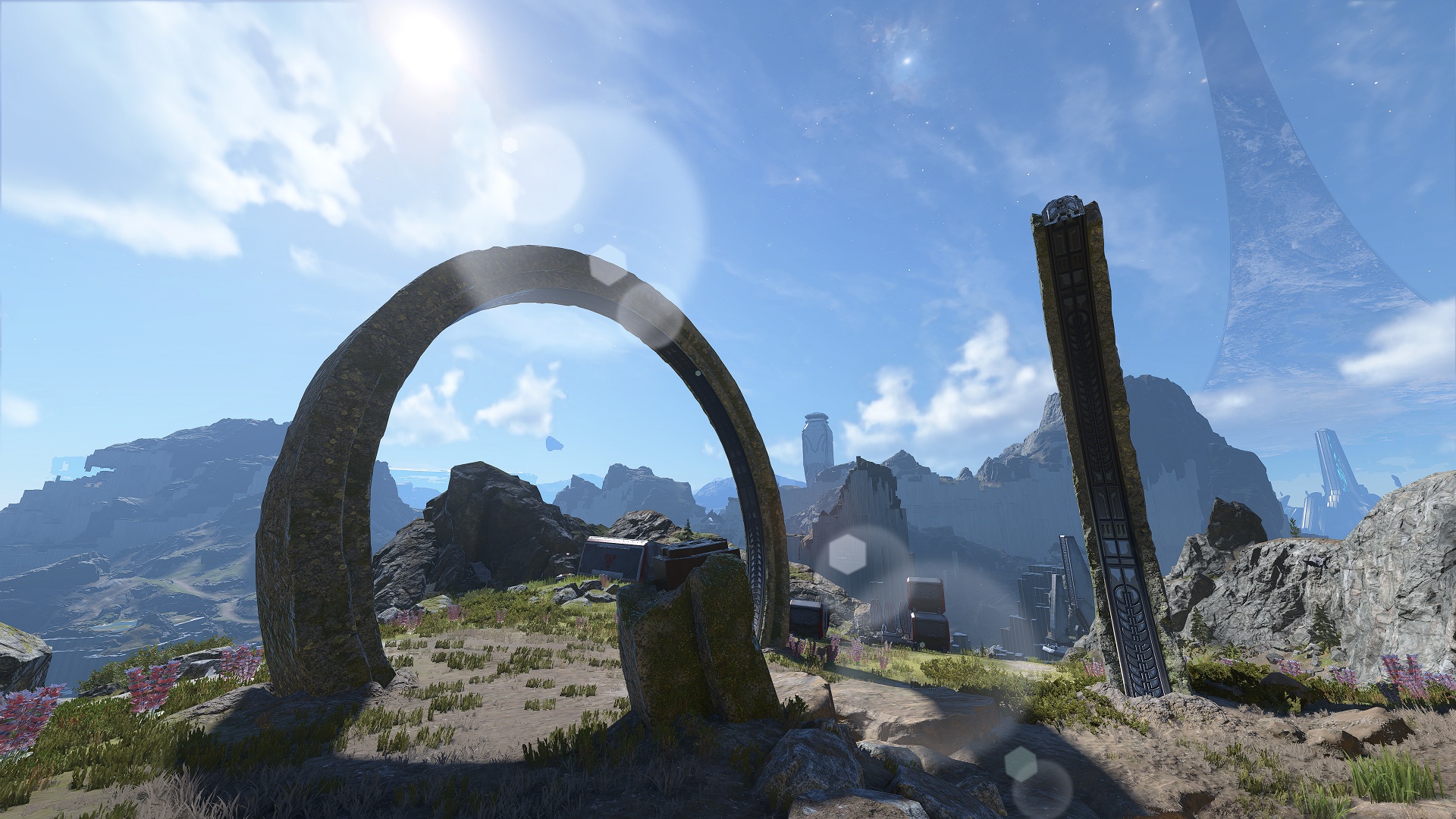 Halo Infinite screenshot of a stone ring totem and view of Zeta Halo