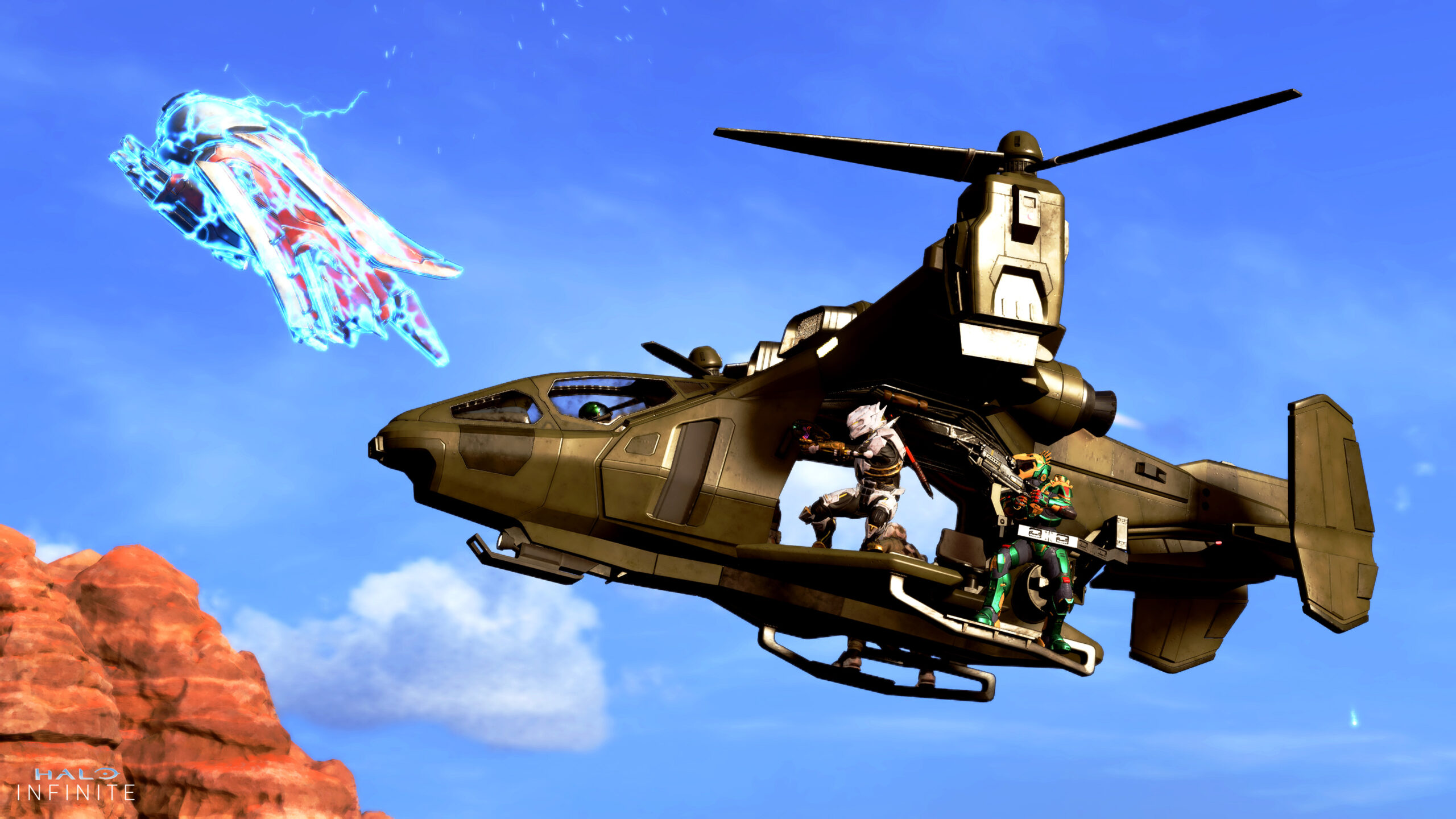 A team of Spartans engage in close aerial combat with a Banshee from their Falcon helicopter. The Banshee is covered in blue lightning, malfunctioning from an overcharged Plasma Pistol shot.