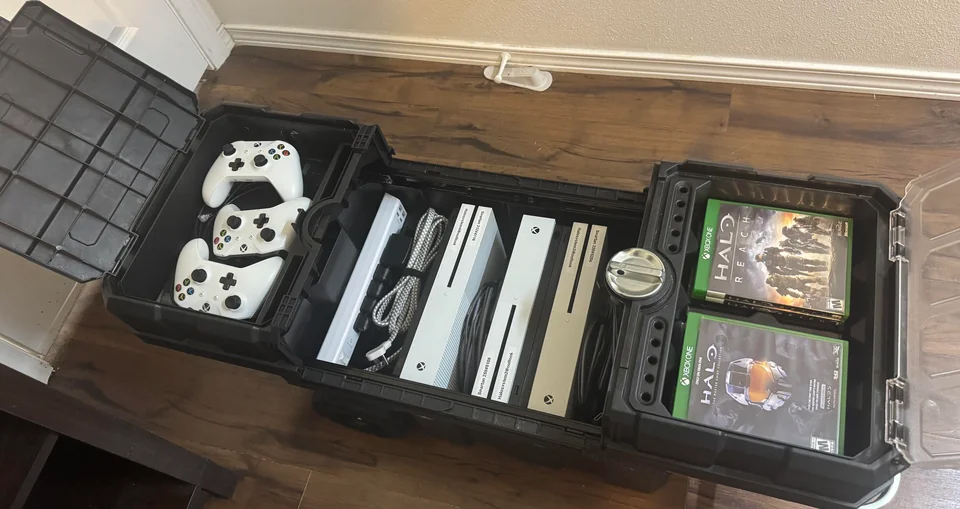 A custom-built rolling LAN kit, complete with controllers, several Xbox consoles, and room for Halo games.