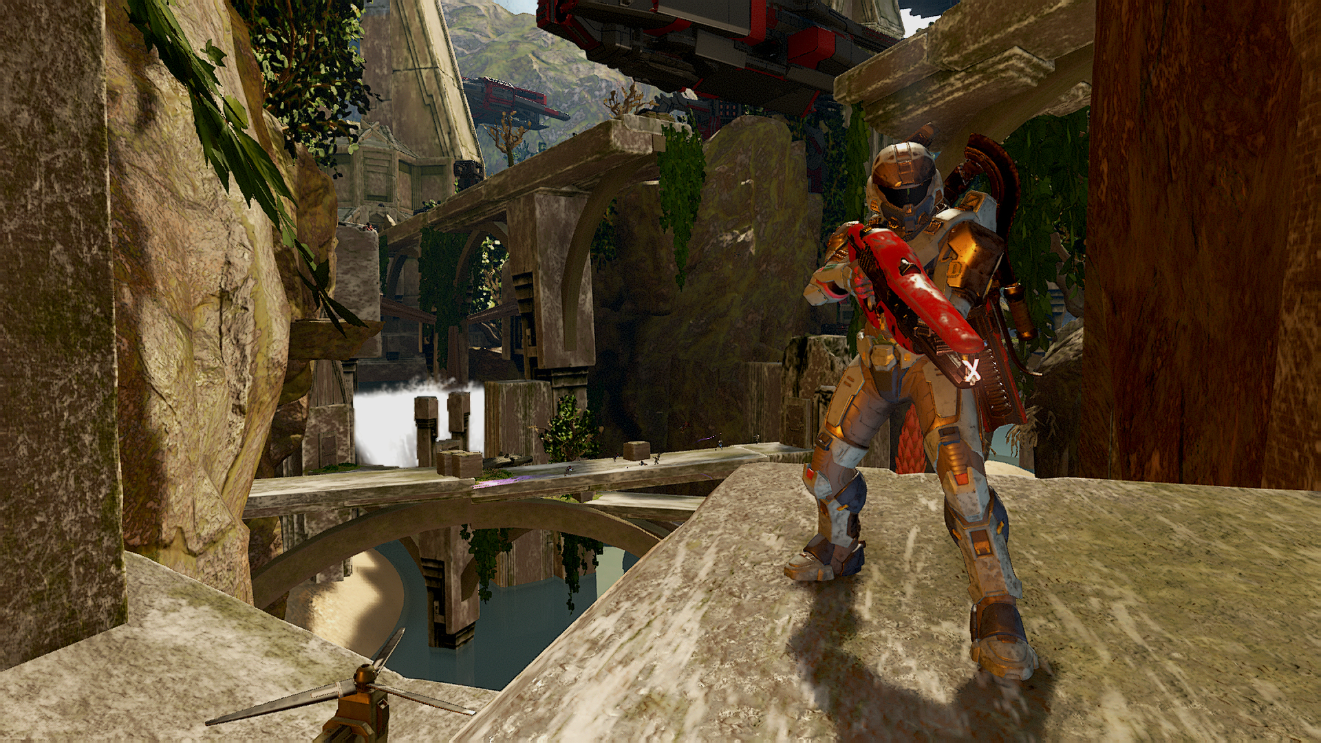 A Spartan standing in the forefront of a map with a bridge and waterfall behind it.