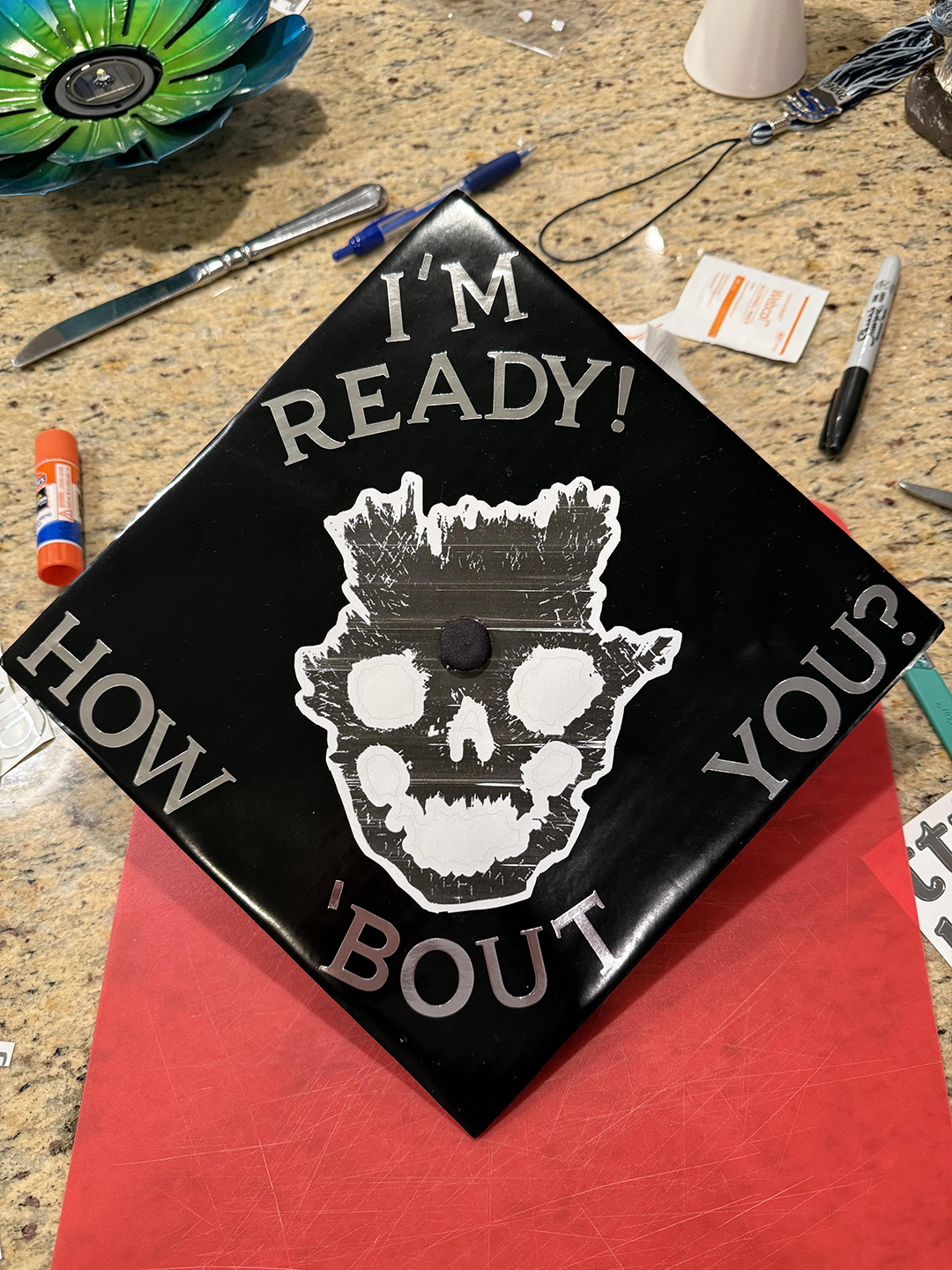 Another graduation cap, this one featuring Emile's skull and "I'm ready, how 'bout you?"