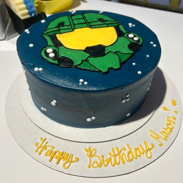 A cake with Master Chief's helmet piped on it.